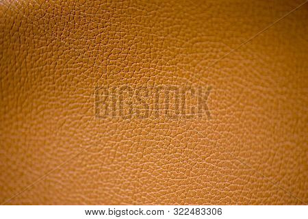 Yellow Artificial Leather Texture Background. Macro Abstraction, Selective Focus.
