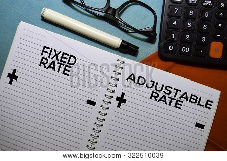 Fixed Rate And Adjustable Rate Text On A Book Isolated On Office Desk.
