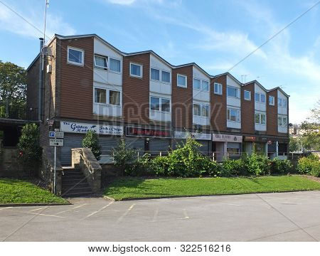Sowerby Bridge, West Yorkshire, United Kingdon - 15 September 2019: A Row Of Local Shops Underneath 