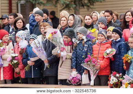 Tyumen, Russia - September 1, 2019: Gymnasium Number 5. School Line Is In Schoolyard With Pupils And