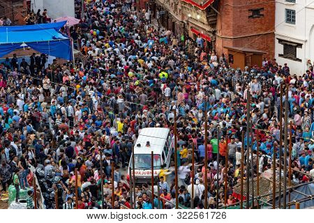 Kathmandu, Nepal - September 13 2019: Ambulance Stuck In Crowd During Indra Jatra Festival