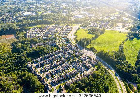 Aerial Picture Suburban Gated Community In Atlanta During Sunset And Sun Rays