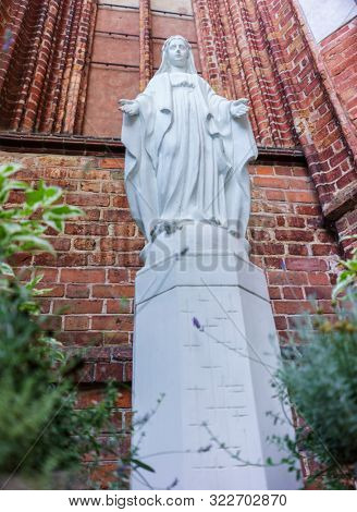 VILNIUS, LITHUANIA - JULY 30, 2019:  Facade of Roman Catholic Church of St. Anna in Vilnius (lit. Church of the Holy Onos) and  Church Of St. Francis And St. Bernard, Details, UNESCO World Heritage