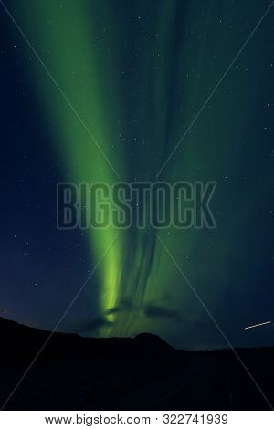 Aurora Borealis against the sunset sky in Iceland, Europe
