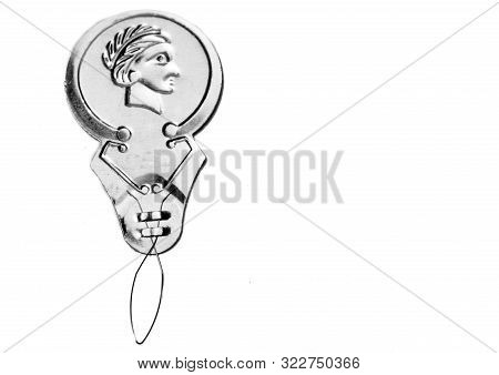 Silver Needle Threader On White Background. Sewing Accessory With Room For Text.