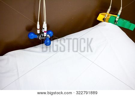 Ecg Or Ekg Electrodes For Electrocardiogram Records Patient Heartbeats On Bed In Hospital.