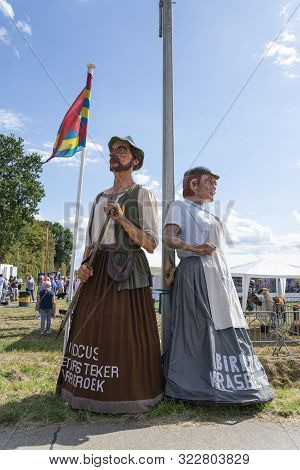 Kieldrecht, Belgium, September 1, 2019, Birken Block And Judocus Peat Plug, Clogs Maker And Turf Plu
