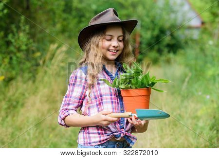Green Life. Small Girl Farmer Care About Plant In Pot. Farming And Agriculture. Spring Season. Hello