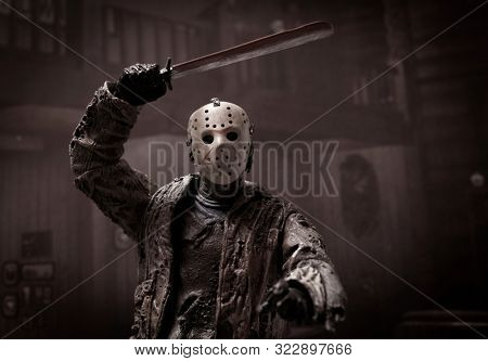 SEPT 17 2019: Horror movie slasher Jason Voorhees stalking a victim inside a cabin at Camp Crystal Lake - Neca Jason action figure