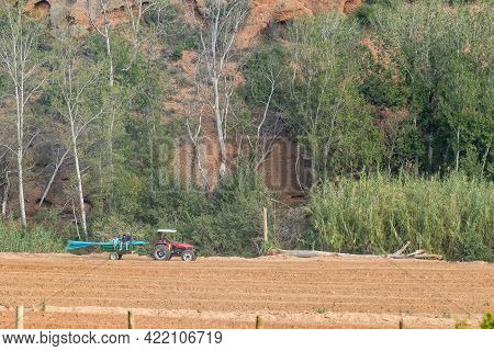 Red Stone Hills, South Africa - April 6, 2021: A Tractor, With Trailer, At Red Stone Hills In The We