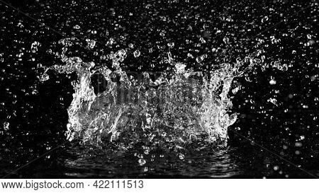 Freeze motion of water splash isolated on black background.
