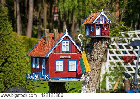 Nida, Lithuania - May 23 2021: Beautiful Old Lithuanian Traditional Wooden Houses Of The Curonian Sp