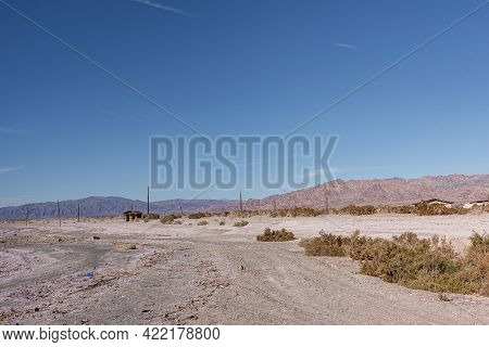 Usa, Ca, Salton Sea - December 28, 2012: White-gray Salty Sand Of Se Shoreline Near Niland Marina Wi