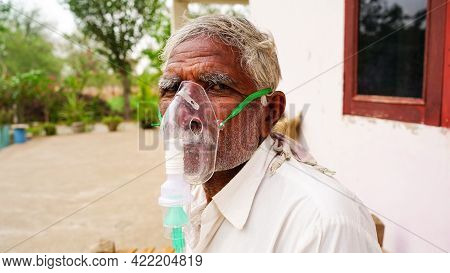 20 May 2021- Reengus, Sikar, India. A Elder Person Infected With Covid 19 Disease. Patient Inhaling 