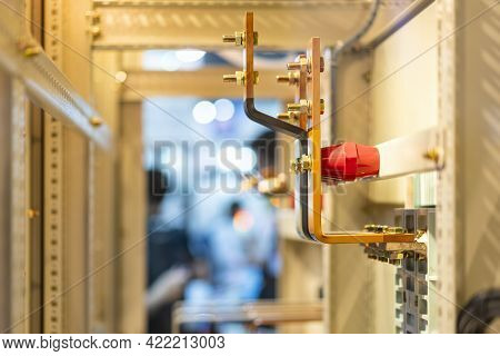 Copper Busbar Bolted To Mounting Insulator And Panel In Electric High Power Cabinet For Supply To Ma