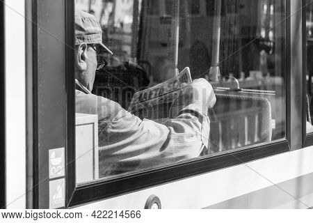 Germany, Munich, March 25, 2017, Older Turk Man Is Reading A Turkish Newspaper Called Hafta Sonu In 