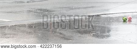 Raindrops Are Falling On A Street During Heavy Rain In Summer