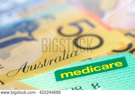 Australian Medicare Card over Money.  Shallow focus, with copy space.