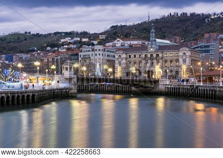 Bilbao, Spain - December 19, 2018: View Of The City Of Bilbao Along Nervion River With The City Hall