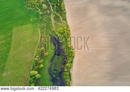 Aerial View Of Agricultural And Green Fields In Countruside. Nature Landscape In Summer Day