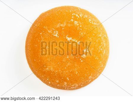Top View Of Single Whole Round Piece Of Palm Sugar On Gray Ceramic Plate