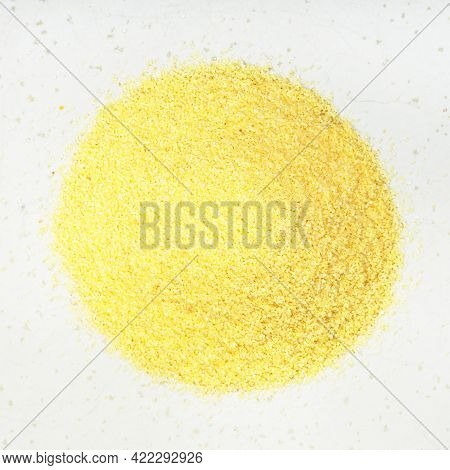 Top View Of Pile Of Durum Wheat Semolina Close Up On Gray Ceramic Plate