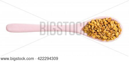 Top View Of Ceramic Spoon With Fenugreek Seeds Isolated On White Background