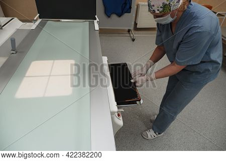 The Work Of A Radiologist In The X-ray Room For Diagnostics.