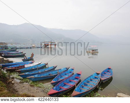 Wooden Canoe Boat Floating In Phewa Tal Or Fewa Freshwater Lake Wait Service Nepali People And Forei