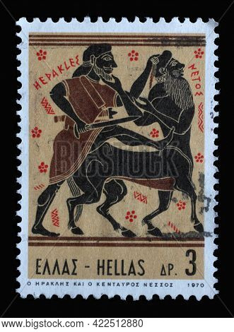 ZAGREB, CROATIA - JUNE 25, 2014: Stamp printed in Greece shows Hercules Deeds - Hercules and Centaur Nessus, circa 1970