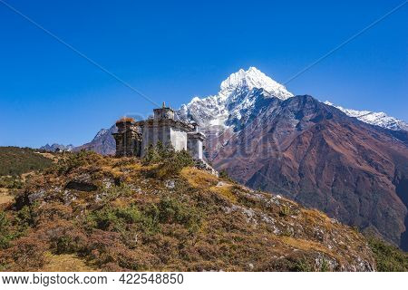 Old Buddhist Stupas And Kantenga Mount In Himalayas.  Sagarmatha National Park, Nepal
