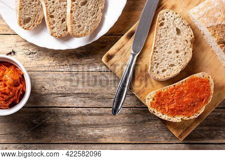 Sliced Toast Bread With Sobrasada On Rustic Wooden Table. Top View. Copy Space