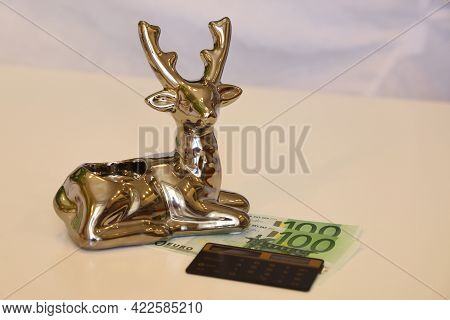 Silver Deer Symbol Of Financial Success, Banknotes And Calculator, Euro Banknotes And Calculator