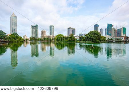 View Of Colombo Cityscape And Skyscrapers Reflection On Beira Lake A Lake In The Center Of The City.