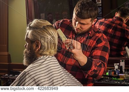 Barber Hairstyle Barbershop. Hipster Getting Haircut. Sharp Object Near Face And Squirming Distracts