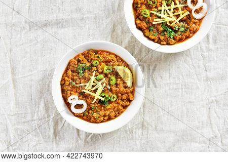 Keema Curry In Bowls Over Light Background. Indian And Pakistani Style Dish. Top View, Flat Lay