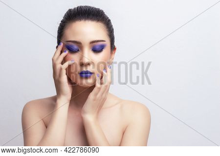 Makeup Asian Woman Close Eyes Show Blue Color Eyeshadow With Extreme Long False Eyelashes. Eyelash E
