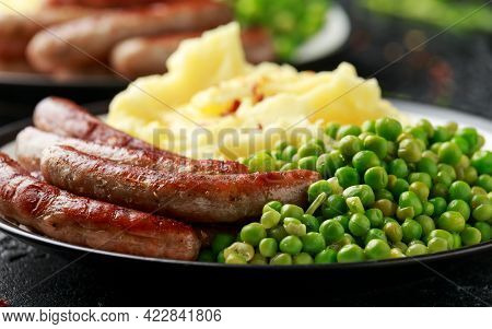 Pork Chipolata Sausages With Home Cooked Mashed Potato And Green Peas