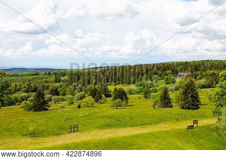 Landscape On Hoherodskopf, Volcano Region In Hesse, Germany. On Cloudy Sunny Warm Summer Day, Meadow