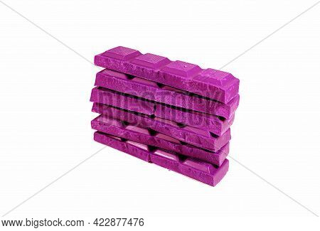 Pop Art Style Hot Pink Colored Stack Of Chocolate Chunks Isolated On White Background