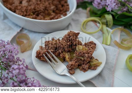 Sweet Home Made Chocolate Rhubarb Crumble With Lilach Flowers