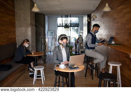 Business People With Laptop Working In Cafe, Small Business, Coronavirus And New Normal Concept.