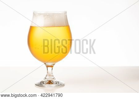Glass Of Cold Golden Beer Isolated On A White Background