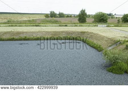 Black Balls To Protect Reservoirs From The Sun. Shade Balls, Small Plastic Balls In The Pond To Keep