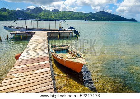 Orange Canoe And Pier