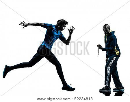 one caucasian man  running sprinting with coach stopwatch in silhouette studio isolated on white background