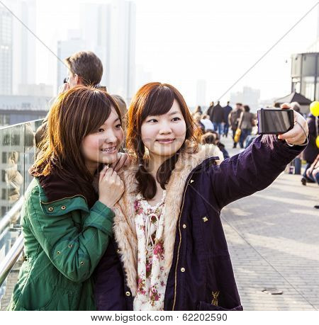 Japanese Tourists Take Self-portraits