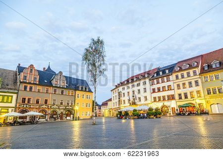 People Enjoy Sunset At Central Market Place In Weimar