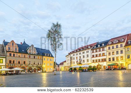 People Enjoy Sunset At Central Market Place In Weimar