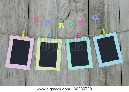 Pastel picture frames hanging on clothesline